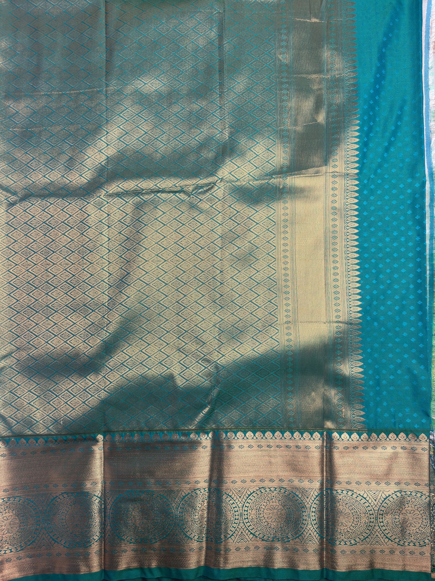 Teakwood Grey Checked Semi-Silk Saree with Copper Zari and Floral Design pallus