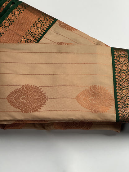 Light Caramel Semi-Silk Saree with Dark Green Border & Copper Zari Floral Design