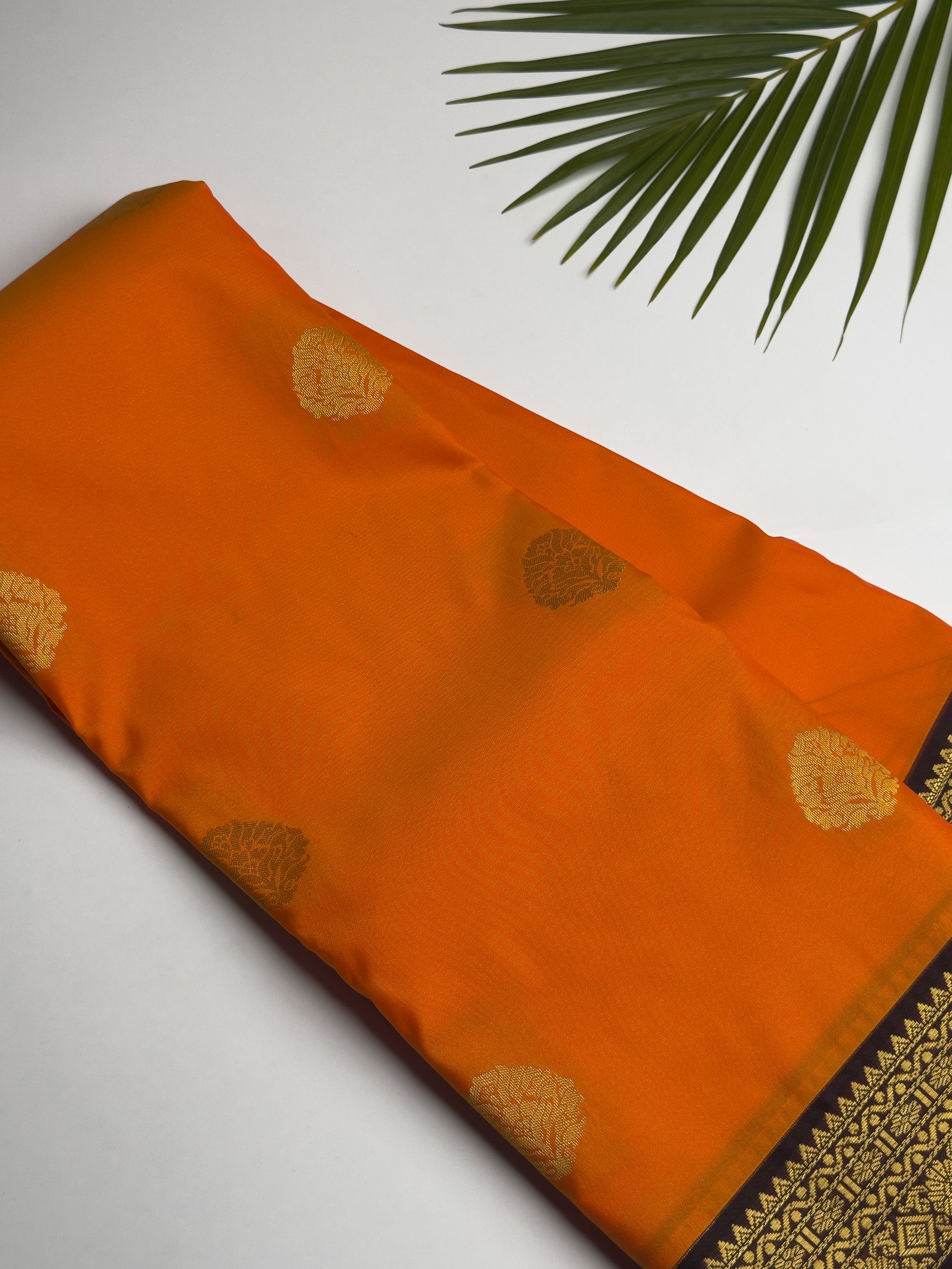 Orange Kanchipuram Semi Silk Saree with Charcoal Brown and Gold Zari Border Design