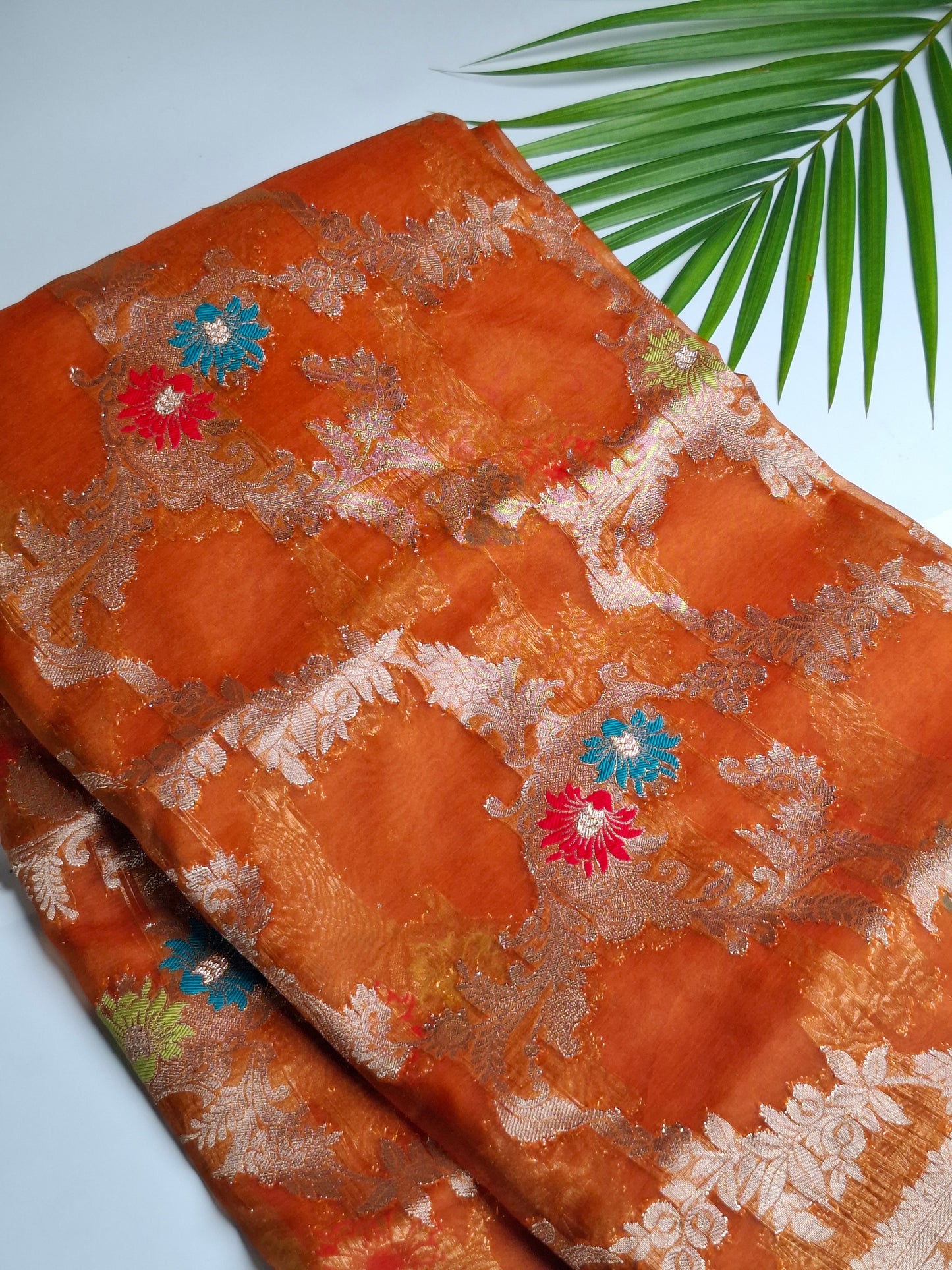 Radiant Orange Banaras Tissue Saree with Gold Borderd Designs