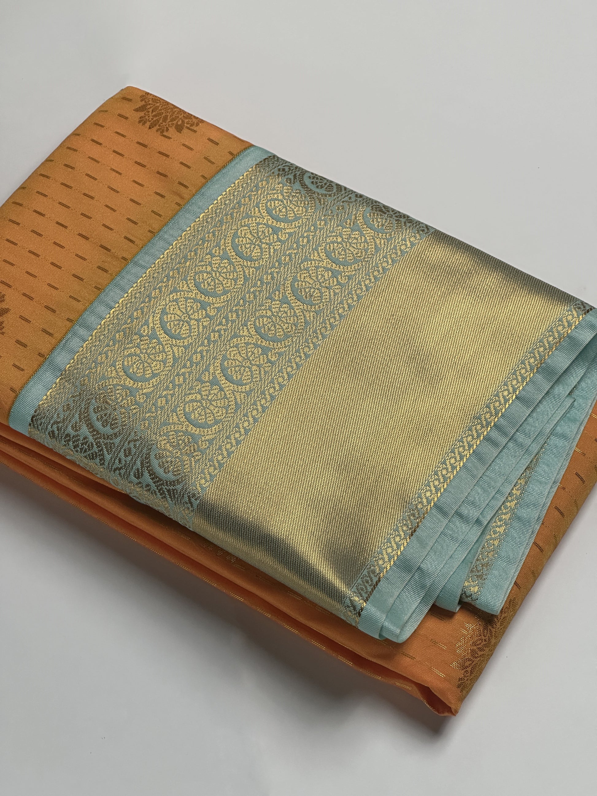 Radiant Orange Semi-Silk Saree with Sky Blue Border & Golden Zari Dotted Floral Design Border