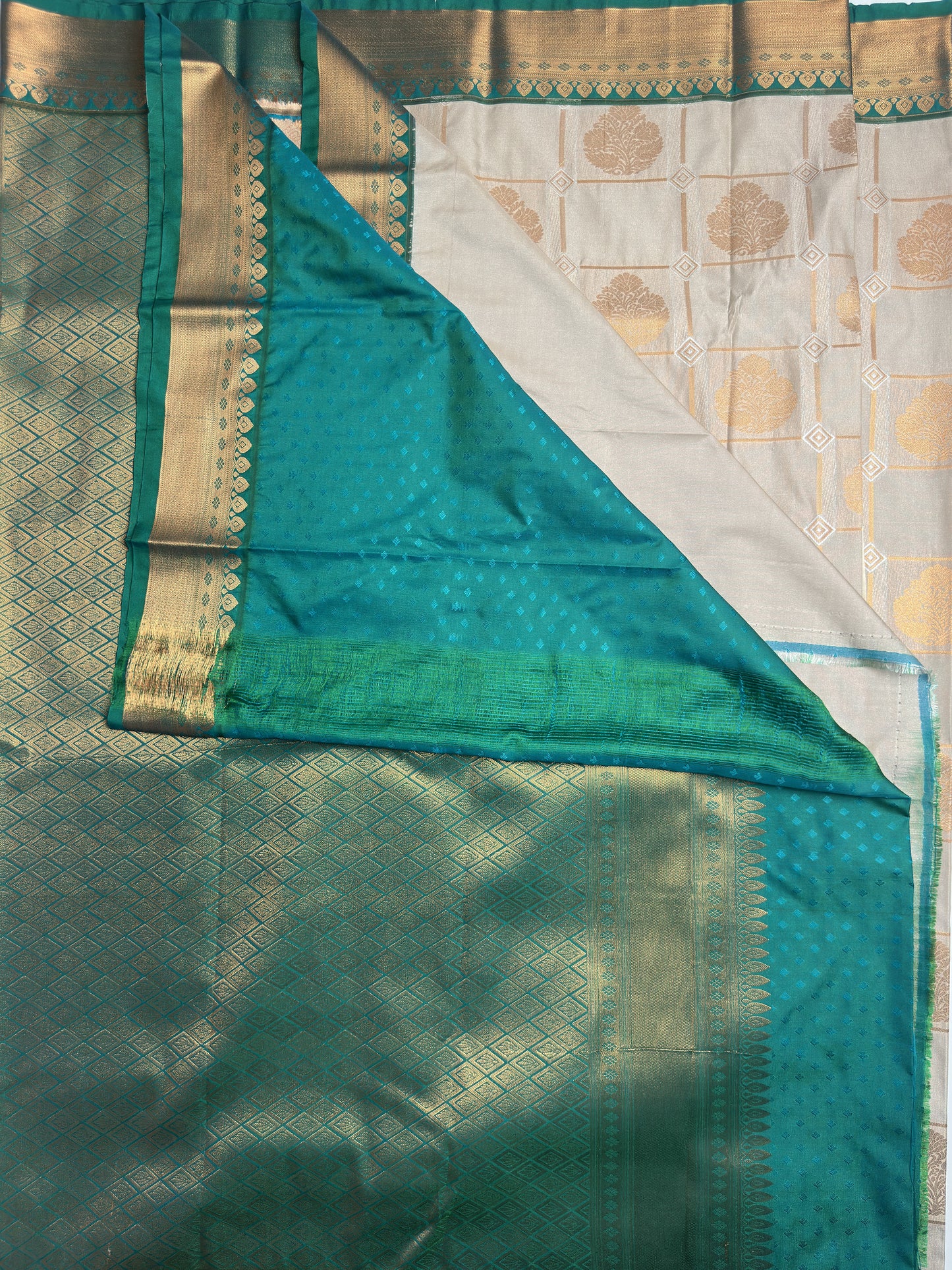 Teakwood Grey Checked Semi-Silk Saree with Copper Zari and Floral Design pallu
